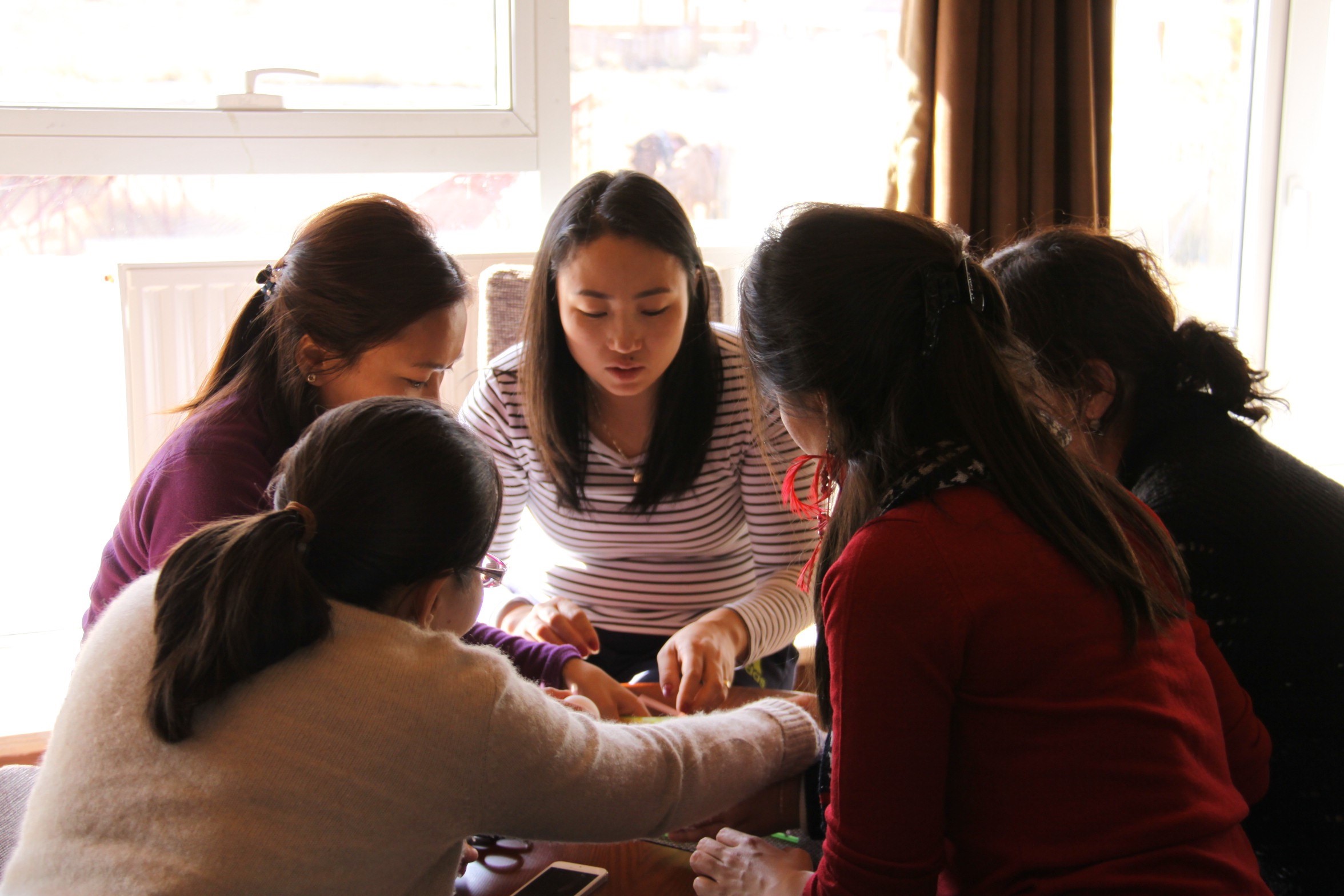 Attendees of the three day Women's Leadership Program (WLP) Orientation Retreat participate in team building activities.